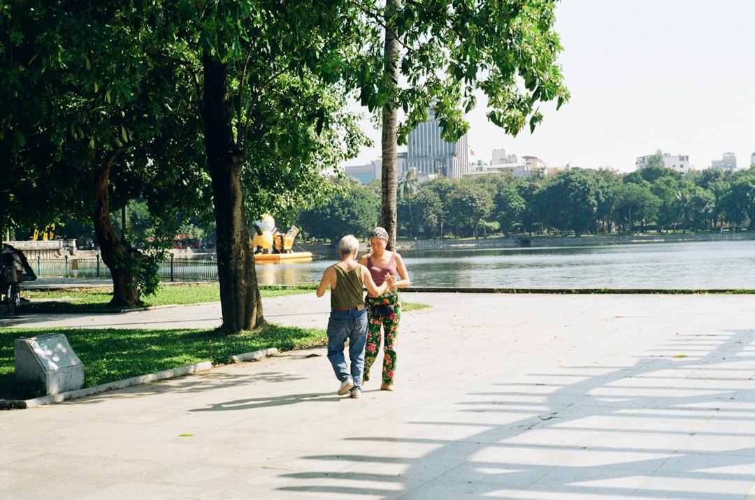 senior couple walking in park